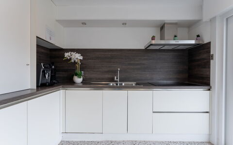 Wanderlust Belgium with Parking: Kitchen, Countertop, Cabinetry, Interior Design, Flooring, Wood, Kitchen Appliance, Home, Floor, Plumbing Fixture