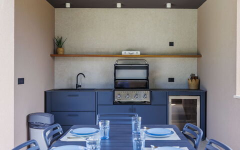 La Mari: Kitchen, Interior Design, Furniture, Countertop, Kitchen Appliance, Wood, Flooring, Cabinetry, Lighting, Kitchen Stove