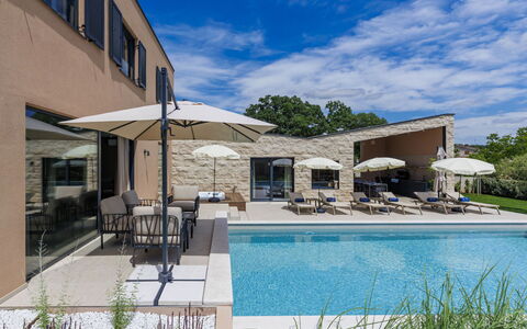 Sola: Swimming Pool, Residential Area, Home, Estate, Shade, Villa, Outdoor Furniture, Resort, Landscaping, Concrete