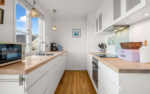 Björk - 10M from the Sea: Countertop, Kitchen, Cabinetry, Flooring, Interior Design, Furniture, Floor, Kitchen Appliance, Wood, Major Appliance