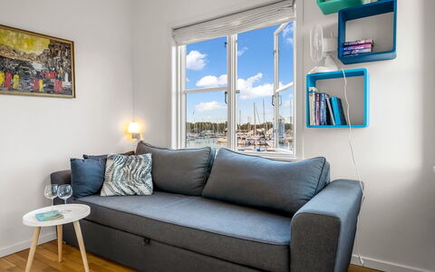 Björk - 10M from the Sea: Furniture, Interior Design, Couch, Flooring, Floor, Living Room, Room, Apartment, Table, Home