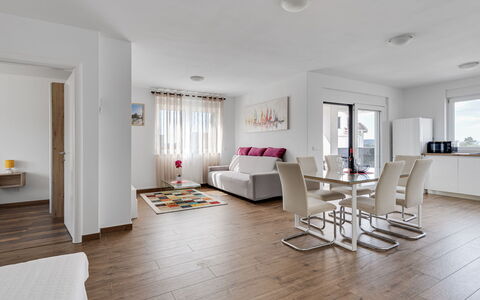 Petra: Furniture, Interior Design, Flooring, Floor, Wood Flooring, Couch, Room, Ceiling, Apartment, Living Room