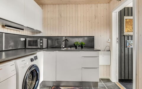 Danail - 250M from the Sea: Major Appliance, Washing Machine, Flooring, Wood, Interior Design, Kitchen, Kitchen Appliance, Ceiling, Floor, Home Appliance