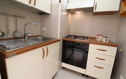 Alice: Kitchen, Cabinetry, Kitchen Appliance, Countertop, Major Appliance, Wood, Flooring, Kitchen Sink, Drawer, Kitchen Stove