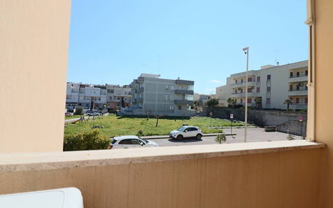 Myriam: Apartment, Residential Area, Architecture, Human Settlement, Urban Design, Condominium, Balcony, Family Car, Parking, Mid-Size Car