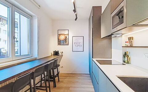 Family and Friends: Interior Design, Flooring, Furniture, Kitchen, Countertop, Ceiling, Floor, Light Fixture, Lighting, Room