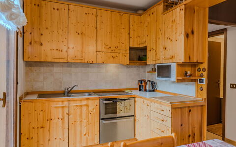 Ginepro: Wood, Cabinetry, Kitchen, Cupboard, Drawer, Countertop, Ceiling, Wood Stain, Major Appliance, Kitchen Appliance
