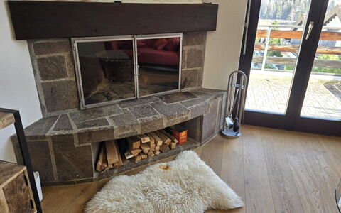 Casa la Schmetta 54: Flooring, Floor, Hearth, Living Room, Natural Material, Wood Flooring, Tile, Stone Wall, Hardwood, Wood Stain