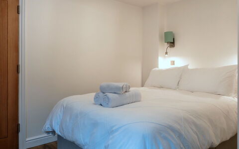 Alpine Cottage: Bedroom, Bed, Wall, Interior Design, Bed Sheet, Bedding, Furniture, Floor, Linens, Ceiling