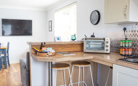 Skeabost Chalet: Furniture, Interior Design, Flooring, Countertop, Kitchen, Wood, Cabinetry, Floor, Kitchen Appliance, Major Appliance