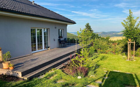 Hillside View: House, Shrub, Home, Land Lot, Garden, Cottage, Groundcover, Slope, Yard