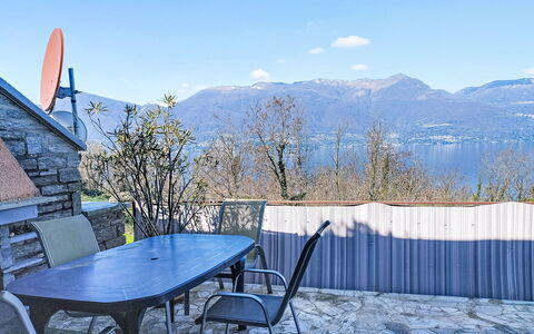 Uliana: Furniture, Wood, Chair, Floor, Sea, Balcony, Fence, Deck, Hardwood, Wood Stain