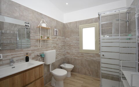 Villa Cosentini: Flooring, Plumbing Fixture, Wall, Floor, Bathroom, Interior Design, Bathroom Sink, Sink, Toilet Seat, Toilet