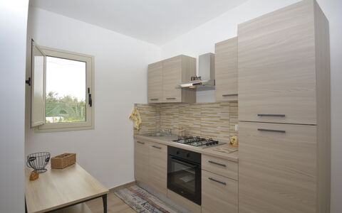 Villa Cosentini: Wall, Kitchen Appliance, Major Appliance, Countertop, Kitchen, Wood, Interior Design, Flooring, Cabinetry, Floor