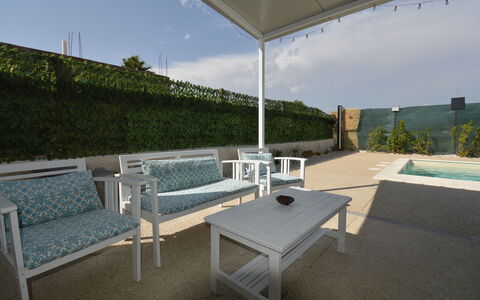 Villa Cosentini: Furniture, Outdoor Furniture, Chair, Table, Floor, Flooring, Swimming Pool, Outdoor Table, Composite Material, Shade