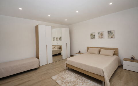 Villa Cosentini: Furniture, Bed, Interior Design, Bedroom, Floor, Flooring, Wall, Wood, Room, Bedding