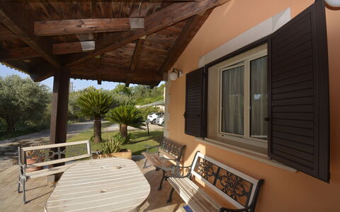 Villa del Monte: Wood, Furniture, Home, Door, Shade, Chair, Cottage, Wood Stain, Outdoor Furniture, Porch