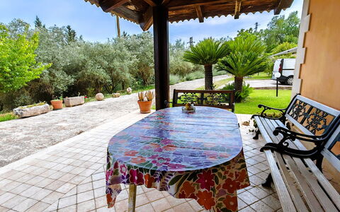 Villa del Monte: Furniture, Chair, Outdoor Furniture, Garden, Flagstone, Shade, Backyard, Outdoor Table, Yard, Landscaping