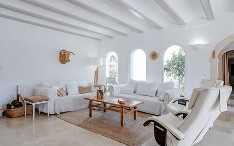 Tika: Furniture, Couch, Wall, Interior Design, Flooring, Home, Living Room, Floor, Apartment, Room