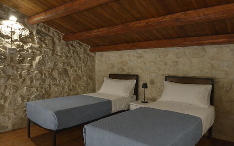 Villa Palmento: Wall, Furniture, Interior Design, Bedroom, Floor, Bed, Bed Frame, Stone Wall, Room, Bedding