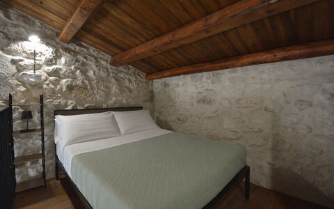 Villa Palmento: Wall, Bedroom, Ceiling, Bed Frame, Bed, Bedding, Stone Wall, Bed Sheet, Linens, Mattress