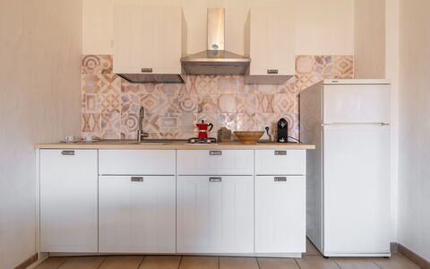 Fortuna: Kitchen, Countertop, Kitchen Appliance, Cabinetry, Major Appliance, Flooring, Interior Design, Kitchen Sink, Floor, Cupboard