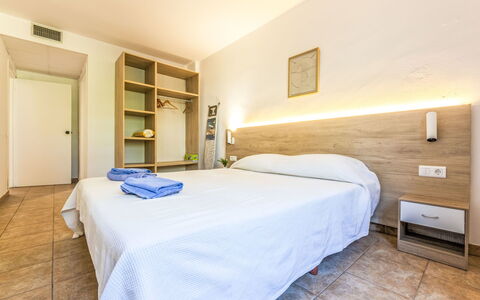 Festival Village: Bed, Ceiling, Bedroom, Apartment, Bedding, Bed Sheet, Bed Frame, Resort, Hotel, Wood Flooring
