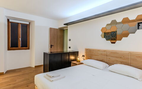 La Torre a Dorio: Interior Design, Wood, Bed, Bedroom, Ceiling, Floor, Flooring, Bedding, Room, Apartment