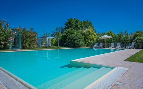 Preseglie Lake Garda: Swimming Pool, Blue, Resort, Composite Material, Leisure, Shade, Eco Hotel, Thermae, Water Feature, Leisure Centre