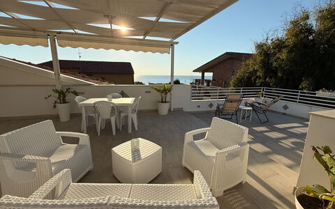 Casa Amare: Furniture, Chair, Outdoor Furniture, Balcony, Outdoor Table, Apartment, Shade, Patio, Houseplant, Umbrella