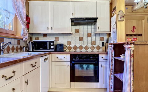 La Suisse Normande: Kitchen, Wood, Interior Design, Cabinetry, Countertop, Kitchen Appliance, Flooring, Furniture, Major Appliance, Drawer