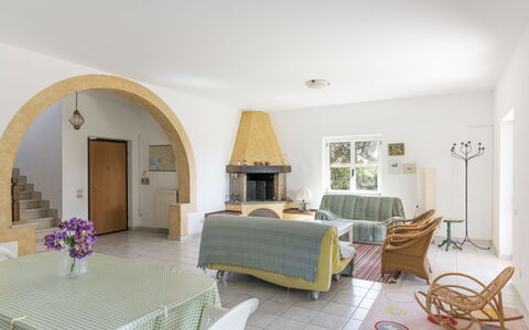 Tarquinia Garden Home: Furniture, Interior Design, Flooring, Floor, Ceiling, Chair, Table, Room, Lighting, Living Room