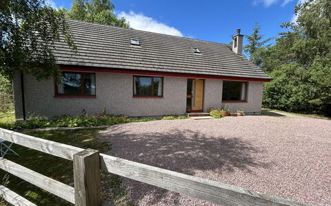 Highland Hillside Retreat: Grass, Building, House, Roof, Cottage, Shrub, Home, Residential Area, Human Settlement