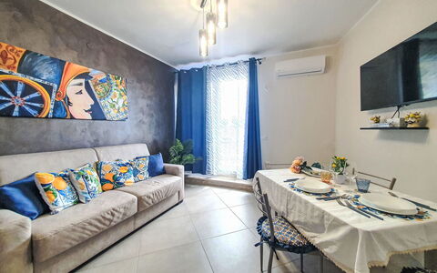 Siciliandò: Furniture, Flooring, Interior Design, Floor, Wood, Couch, Room, Table, Lighting, Apartment
