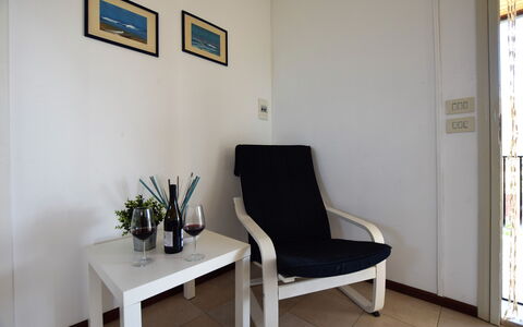 Villa Andrea: Furniture, Flooring, Floor, Interior Design, Chair, Room, Living Room, Picture Frame, Comfort, Coffee Table