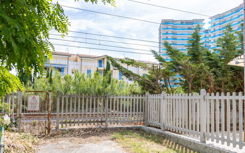 Casale Oleandro Marino: Residential Area, Fence, Apartment, Condominium, Home Fencing, Picket Fence, Garden, Shade, Landscaping, Balcony