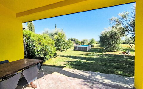 Cottage Girasole di Mare: Furniture, Interior Design, Flooring, Chair, Floor, Table, Kitchen & Dining Room Table, Shade, Ceiling, Wood Stain