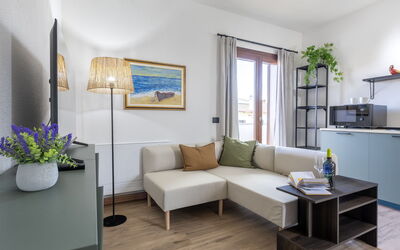 Marina di Sorso 5: Furniture, Interior Design, Flooring, Floor, Wood, Couch, Table, Room, Living Room, Lighting