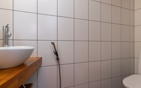 Villa Antti: Flooring, Bathroom, Wall, Plumbing Fixture, Floor, Interior Design, Plumbing, Tile, Tap, Toilet