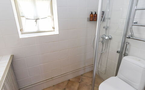 Gammelgård Jahtimaja: Plumbing Fixture, Flooring, Bathroom, Floor, Toilet, Toilet Seat, Plumbing, Tile, Room, Shower