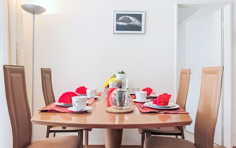 Holiday Apt. T: Furniture, Interior Design, Table, Dining Room, Wood, Kitchen & Dining Room Table, Flooring, Chair, Lighting, Room