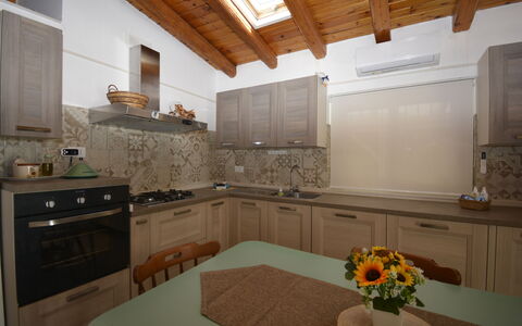 Villa Mameli: Kitchen, Countertop, Interior Design, Kitchen Appliance, Wood, Flooring, Kitchen Sink, Cabinetry, Major Appliance, Furniture