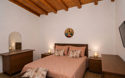 Villa Mameli: Bed, Furniture, Interior Design, Bedroom, Bedding, Wall, Flooring, Bed Sheet, Floor, Wood
