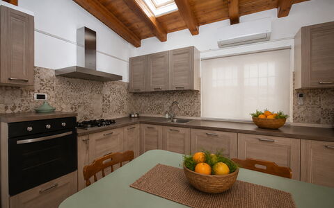 Villa Mameli: Kitchen, Countertop, Kitchen Appliance, Furniture, Interior Design, Cabinetry, Major Appliance, Flooring, Wood, Kitchen Sink