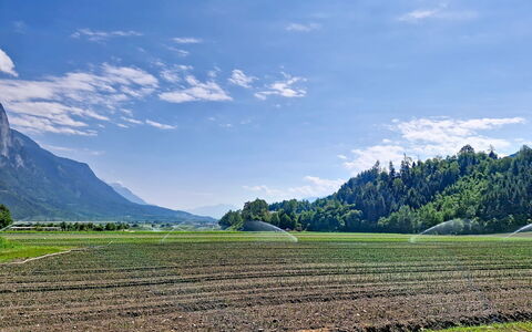 A3: Sky, Mountainous Landforms, Green, Grass, Cloud, Mountain, Hill, Field, Natural Landscape, Grassland
