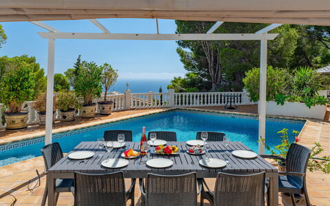 Preciados: Furniture, Outdoor Furniture, Chair, Table, Swimming Pool, Kitchen & Dining Room Table, Resort, Outdoor Table, Shade, Umbrella