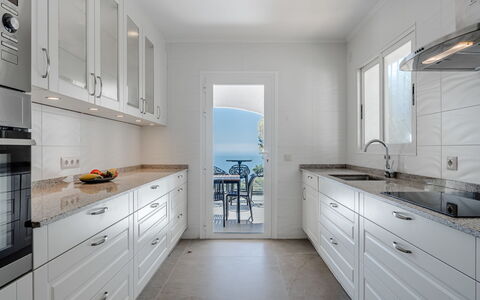 Preciados: Kitchen, Countertop, Cabinetry, Flooring, Furniture, Wood, Interior Design, Kitchen Appliance, Floor, Drawer