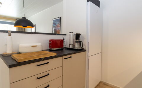 Lomapesä: Countertop, Furniture, Interior Design, Cabinetry, Kitchen, Kitchen Appliance, Flooring, Wood, Major Appliance, Room