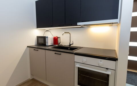 Lomapesä: Kitchen, Kitchen Appliance, Countertop, Major Appliance, Interior Design, Cabinetry, Kitchen Sink, Flooring, Kitchen Stove, Stove