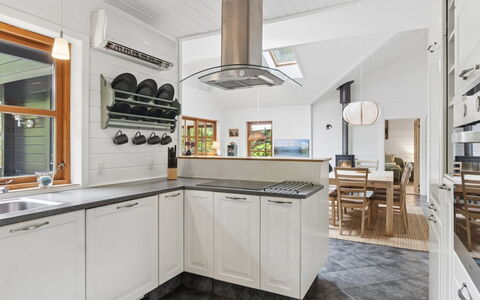 Pertti - 625M from the Sea: Kitchen, Countertop, Flooring, Kitchen Appliance, Interior Design, Cabinetry, Wood, Ceiling, Major Appliance, Floor